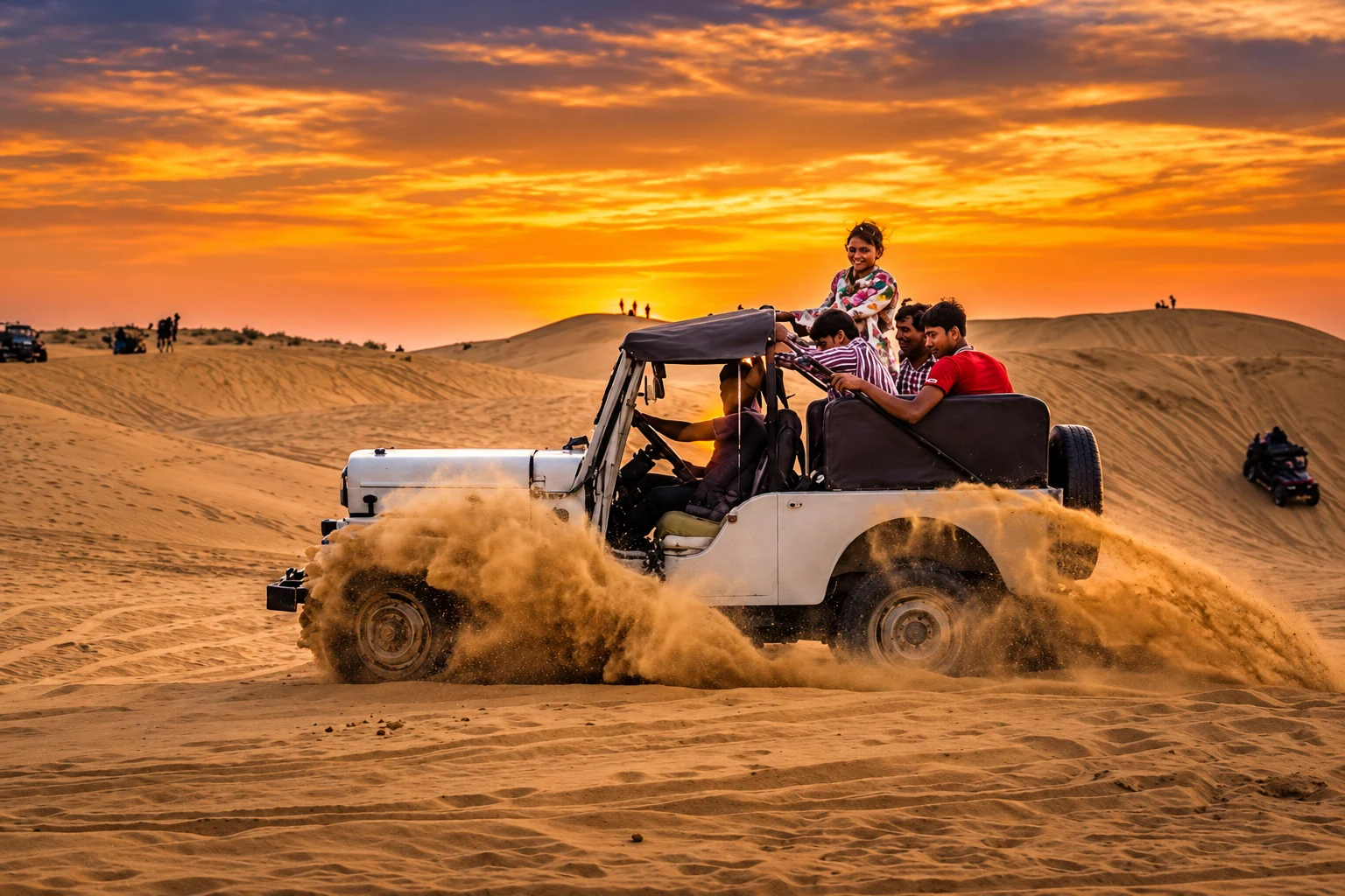 An open jeep crossing the dunes at sunset